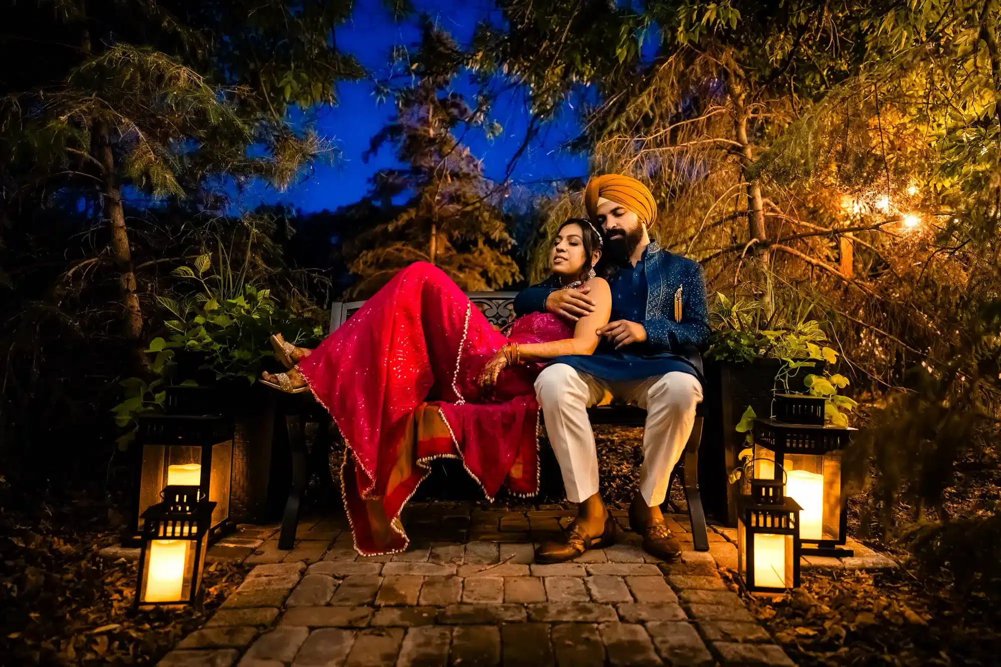 Couple sitting on bench outside their Indian Wedding Ashgrove Acres